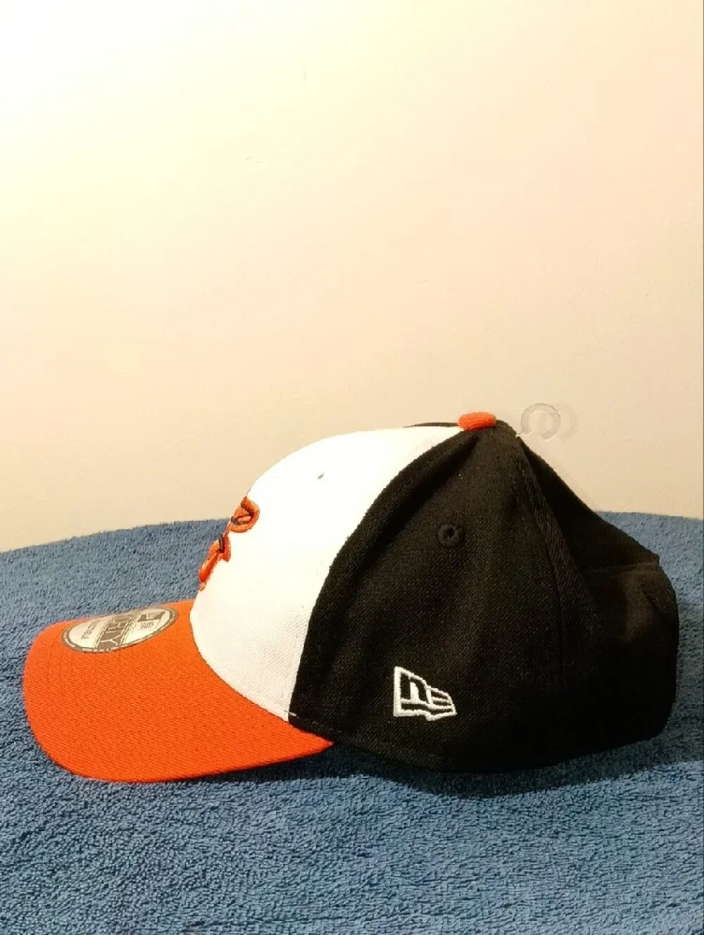New Era Orioles 9FORTY Cap in White, Black, Orange